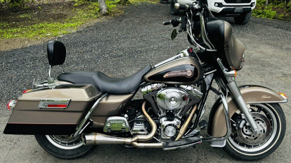 Harley-Davidson Exhaust Upgrade Guide with aftermarket performance exhaust installed on a touring motorcycle.